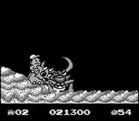 une photo d'Ã©cran de Adventure Island 2 - Aliens in Paradise sur Nintendo Game Boy